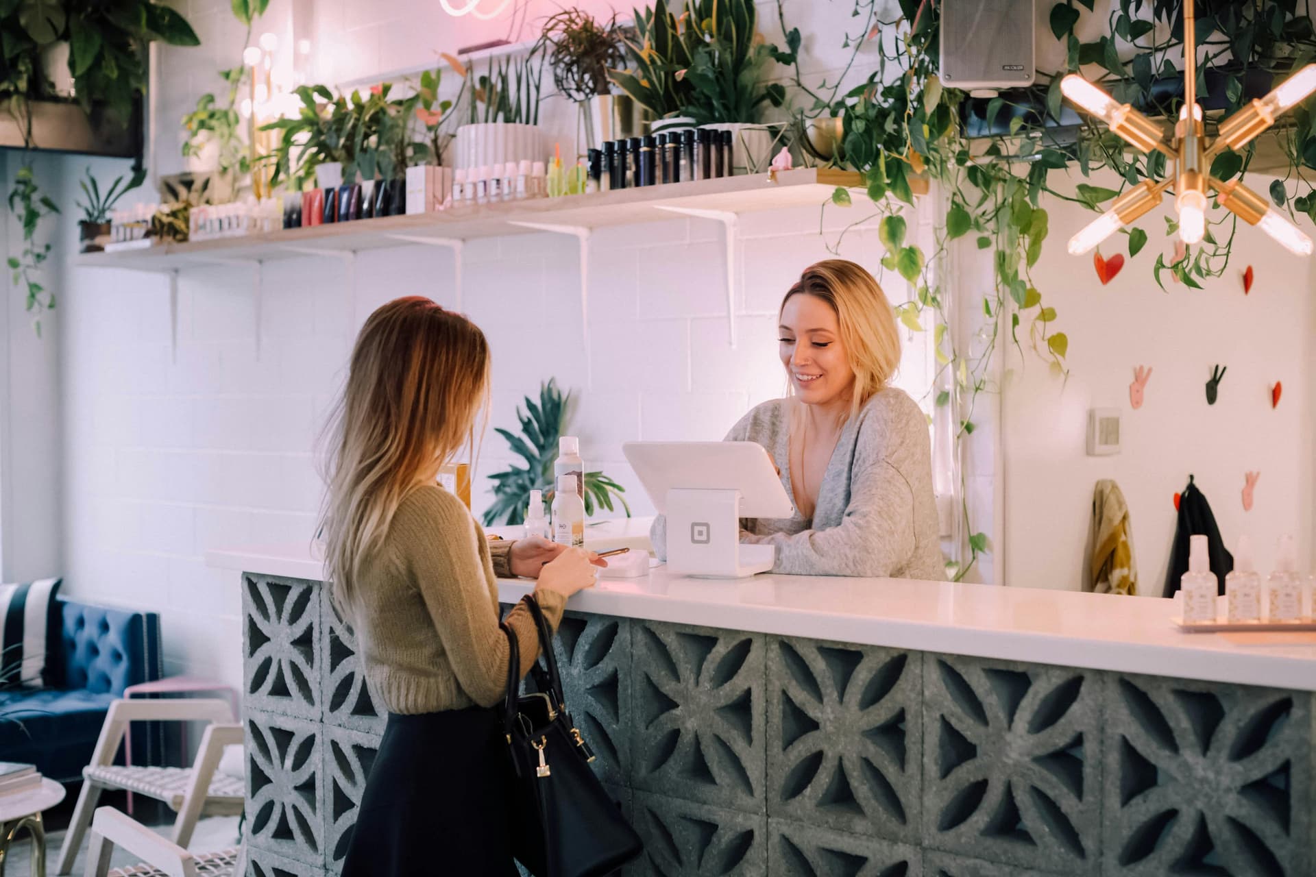 Woman ordering from Cashier woman
