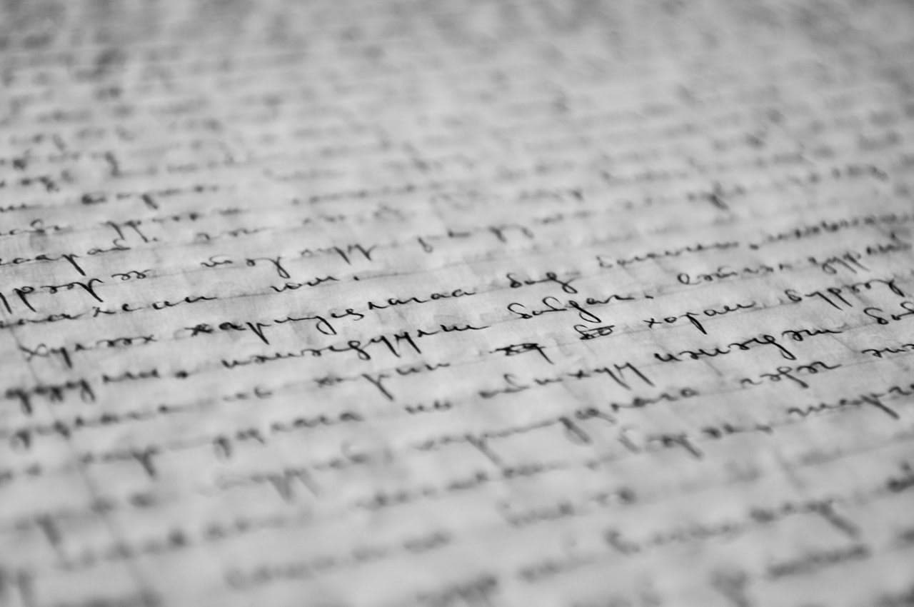 Handwritten text fills the page, with cursive script in black ink on white paper. The writing is slightly blurred, enhancing a sense of historical or personal significance.