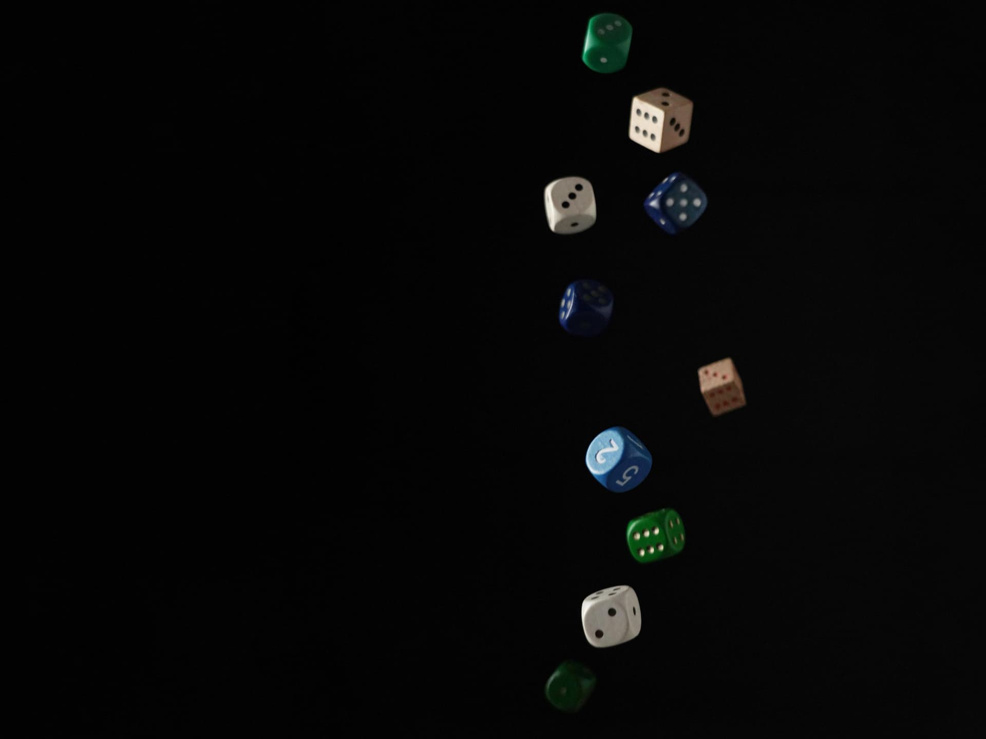 A group of dices are flying in the air